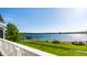 Scenic lake view from the property featuring lush greenery and peaceful waterfront access at 7849 Clearwater Cove Dr, Indianapolis, IN 46240