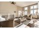 Bright living room with vaulted ceilings, modern furnishings, and large windows at 7849 Clearwater Cove Dr, Indianapolis, IN 46240