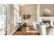 Stylish living room featuring a fireplace, bright windows, and sophisticated decor at 7849 Clearwater Cove Dr, Indianapolis, IN 46240