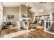 Open living room with vaulted ceilings, fireplace, hardwood floors and views into the eat-in kitchen at 7849 Clearwater Cove Dr, Indianapolis, IN 46240
