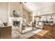 Spacious living room with fireplace, modern furniture, and an open layout to kitchen at 7849 Clearwater Cove Dr, Indianapolis, IN 46240