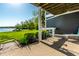 Outdoor patio area with bar seating and lake views, perfect for entertaining and relaxing at 7849 Clearwater Cove Dr, Indianapolis, IN 46240