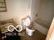 Bathroom featuring a sink, toilet, and bathtub at 7916 Catawba Ct, Indianapolis, IN 46217