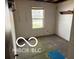 A modestly sized bedroom, featuring natural light from the window at 7916 Catawba Ct, Indianapolis, IN 46217