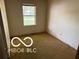 Cozy bedroom with a window that provides natural light at 7916 Catawba Ct, Indianapolis, IN 46217