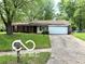 Charming single-story home with an attached garage and a well-maintained front lawn at 7916 Catawba Ct, Indianapolis, IN 46217