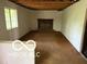 Spacious living room showcasing a brick fireplace and abundant natural light at 7916 Catawba Ct, Indianapolis, IN 46217