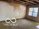 Spacious living room with exposed unfinished ceiling and a large window allowing ample natural light at 7916 Catawba Ct, Indianapolis, IN 46217