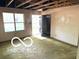 A bright and airy living area with a large window offering ample natural light and an exterior door at 7916 Catawba Ct, Indianapolis, IN 46217
