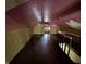 Attic space with wood paneling and low ceilings at 811 N Oxford St, Indianapolis, IN 46201
