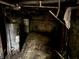 Unfinished basement with water heater, piping and concrete floor at 811 N Oxford St, Indianapolis, IN 46201