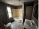 Bathroom featuring a toilet, tub/shower combo, and vanity at 811 N Oxford St, Indianapolis, IN 46201