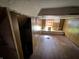 Attic style bedroom with wood paneled walls, wood flooring and a window with blinds at 811 N Oxford St, Indianapolis, IN 46201