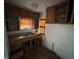 Functional kitchen featuring classic wood cabinets and a double sink, offering ample storage and workspace at 811 N Oxford St, Indianapolis, IN 46201