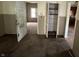 Open room featuring a doorway, a hallway, and a shelved closet at 811 N Oxford St, Indianapolis, IN 46201