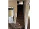 Carpeted stairway leading to upper level, with bathroom view on left at 811 N Oxford St, Indianapolis, IN 46201