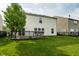Backyard featuring a wooden deck, a well-maintained lawn, and a neighboring home at 8269 S Midnight Dr, Pendleton, IN 46064