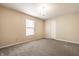 Cozy carpeted bedroom with a window and a chandelier, offering ample natural light at 8269 S Midnight Dr, Pendleton, IN 46064