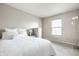 Bright bedroom featuring a comfortable bed with white linens and a standing lamp near a window at 8269 S Midnight Dr, Pendleton, IN 46064