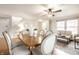 Dining area with a round table, six chairs, and access to the living room at 8269 S Midnight Dr, Pendleton, IN 46064