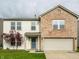 Charming two-story home with a brick facade and well-maintained lawn at 8269 S Midnight Dr, Pendleton, IN 46064