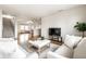 Spacious living room with neutral colored walls and hardwood floors has a view to a staircase at 8269 S Midnight Dr, Pendleton, IN 46064