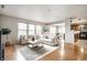 Bright living room with hardwood floors, two sofas, and large windows at 8269 S Midnight Dr, Pendleton, IN 46064