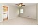 Bedroom with carpet floors, neutral walls, a ceiling fan, and a bathroom at 8606 N Washington Blvd, Indianapolis, IN 46240
