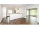 Stylish kitchen with white cabinetry, stainless steel appliances, and a view into another room at 8606 N Washington Blvd, Indianapolis, IN 46240
