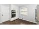 Well-equipped kitchen with built-in ovens, ample storage, and a bright window at 8606 N Washington Blvd, Indianapolis, IN 46240