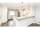 Bright kitchen with white cabinets, granite countertops, and stainless steel appliances at 8606 N Washington Blvd, Indianapolis, IN 46240