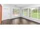 Beautiful living room with hardwood floors and lots of windows for natural light at 8606 N Washington Blvd, Indianapolis, IN 46240