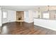 Open concept living area with a stone fireplace and a view into the modern kitchen at 8606 N Washington Blvd, Indianapolis, IN 46240