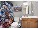 Bathroom features a Marvel Avengers shower curtain and a wooden vanity at 8709 Orchard Grove Ln, Camby, IN 46113