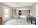 Open concept living and dining area features a stone fireplace and access to the backyard at 8709 Orchard Grove Ln, Camby, IN 46113