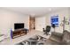 Finished basement area with TV and seating provides extra living space at 8811 Dorill Creek Ln, Indianapolis, IN 46259