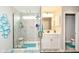 Updated bathroom featuring glass shower, single vanity, and modern fixtures at 8811 Dorill Creek Ln, Indianapolis, IN 46259