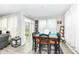 Eat-in kitchen offers a dining table set, sliding glass doors with backyard views and bright natural light at 8811 Dorill Creek Ln, Indianapolis, IN 46259