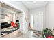 Bright entryway with a white front door, light gray walls, and stylish decor at 8811 Dorill Creek Ln, Indianapolis, IN 46259