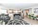 Expansive living room open to the kitchen, featuring hardwood floors and comfortable seating at 8811 Dorill Creek Ln, Indianapolis, IN 46259