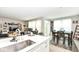 Open concept living room area features an eat-in kitchen, neutral walls and stylish decorative accents at 8811 Dorill Creek Ln, Indianapolis, IN 46259