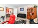 Well-lit living room with a black sofa, hardwood floors, and elegant decor at 8811 Dorill Creek Ln, Indianapolis, IN 46259