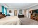 Spacious main bedroom with ensuite bathroom, closets, and sitting area at 8811 Dorill Creek Ln, Indianapolis, IN 46259