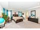 Large main bedroom with sitting area, natural light and ensuite bathroom access at 8811 Dorill Creek Ln, Indianapolis, IN 46259