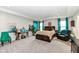 Spacious main bedroom features tray ceilings, sitting area, and natural light at 8811 Dorill Creek Ln, Indianapolis, IN 46259