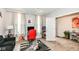 Home office featuring neutral walls, a red office chair, and natural light from the windows at 8811 Dorill Creek Ln, Indianapolis, IN 46259