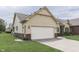 Exterior shot of the house, highlighting its garage and curb appeal at 948 Peppermill Run, Greenwood, IN 46143