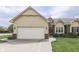 Charming single-Gathering home with a two-car garage, manicured lawn, and traditional design elements at 948 Peppermill Run, Greenwood, IN 46143