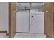 Close-up of laundry closet with white washer and dryer set at 948 Peppermill Run, Greenwood, IN 46143