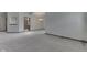Spacious living area with neutral carpet, light walls, chandelier, and an open doorway into the next room at 948 Peppermill Run, Greenwood, IN 46143